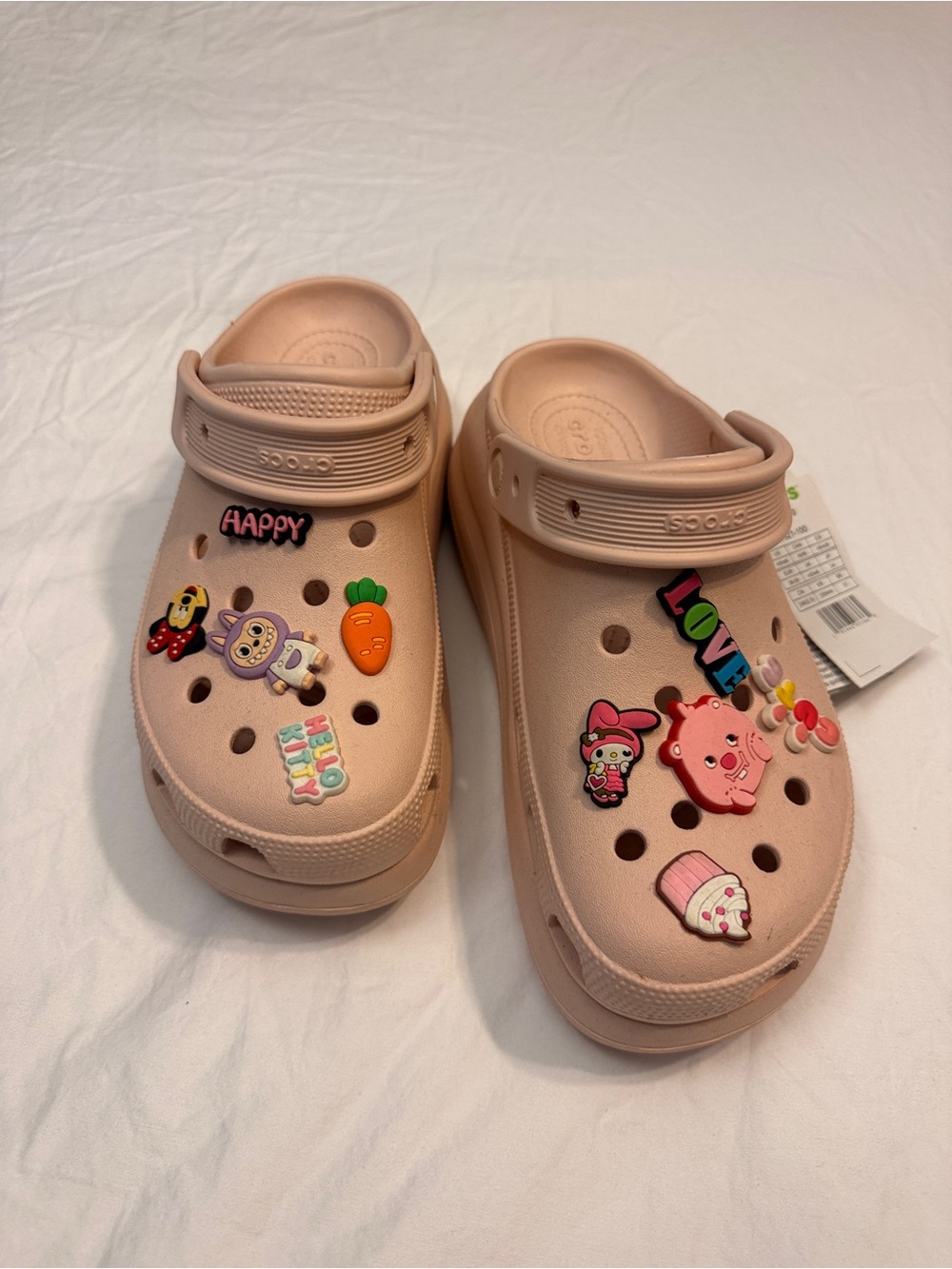 Crocs Classic Clog in Light Pink with Character Charms